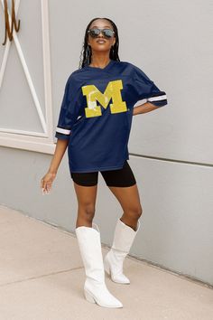 This iconic oversized fashion jersey is the perfect addition to any wardrobe. It features a classic design with a modern twist, making it a timeless piece. The jersey is made from a lightweight and breathable fabric, making it comfortable to wear all day. It also features a unique OPTION PLAY logo on the front, adding a stylish touch. With its oversized fit, this jersey is sure to make a statement. Whether you're hitting the streets or the gym, this jersey is sure to turn heads. Play Logo, Oversized Fashion, Fabric Making, Michigan Wolverines, The Streets, Timeless Pieces, Classic Design, Breathable Fabric, Michigan