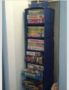 there is a blue tower that has many games on top of it in the corner