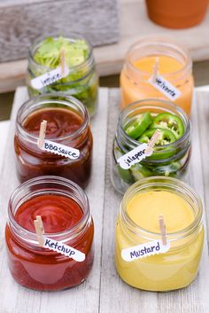 several jars filled with different types of food