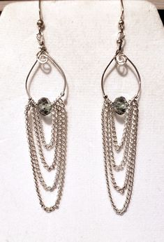 "I love these earrings, they are unique and different.  Handmade Sterling Silver wire hoop with swirl designs with cascading chair with a silver bead in the center.  Earrings measure about 2\" from top to bottom with a French wire hook." Pierced Dangle Earrings With Wire, Silver Dangle Wire Earrings, Wire Wrapped Metal Chandelier Earrings, Silver Sterling Hoop Earrings With Dangling Beads, Nickel-free Dangle Wrap Earrings In Silver Plated Wire, Nickel-free Silver Plated Dangle Wrap Earrings, Silver Wire Dangle Wrap Earrings, Silver Wire Dangle Jewelry, Silver Wire Wrap Dangle Earrings