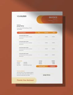 an invoice form with orange and yellow accents on the front, sitting on top of a brown surface