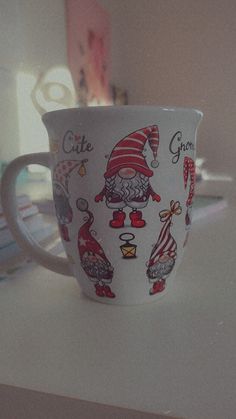 a coffee cup with santa claus on it