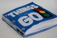 a blue book with the words things that go written on it and a traffic light