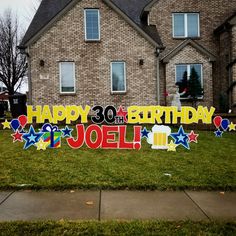 a birthday sign in front of a house