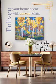 a dining room table with two chairs and a painting on the wall above it that says enjoy your home decor with canvas prints