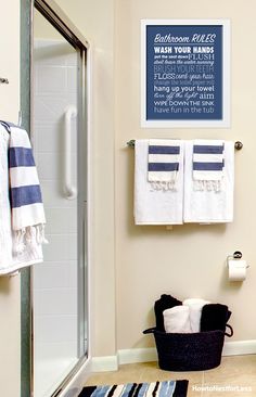 a bathroom with towels hanging on the wall