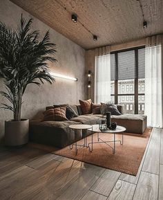 a living room filled with furniture and a large window covered in shades of grey, brown and white