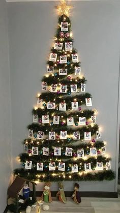 a decorated christmas tree with pictures on it