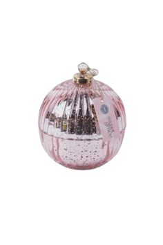 a pink glass ornament on a white background