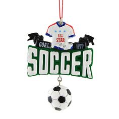 a soccer ornament hanging from a red string