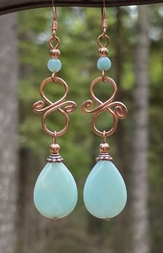 "Wire wrapped Amazonite Boho dangle earrings. Called the Stone of Courage and the Stone of Truth, Amazonite empowers one to search the self and discover one's own truths and integrity, and to move beyond fear of judgment or confrontation with others to live in alignment with those beliefs and values. Amazonite, also known as \"Amazon stone,\" is a semi opaque blue-green variety of microcline feldspar. Amazonite is a mineral of limited occurrence and is present in parts of Brazil, Colorado and Vi Wire Wrapped Bead Earrings, Boho Wire Jewelry, Wire Wrapped Earrings Tutorial, Wire Wrap Earrings, Wire Earrings Handmade, Wire Jewelry Earrings, Wire Jewelry Patterns, Wire Wrap Jewelry Designs, Handmade Dangle Earrings