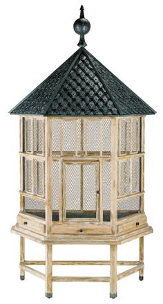 a wooden bird feeder with a black roof