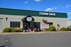 the outside of a building with a sign that says tusen tack on it's front