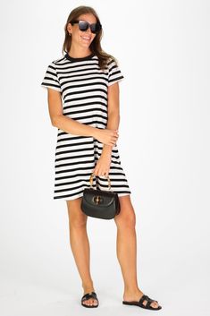 Want to look chic in an instant? Try out the Tallie! This closet staple is the most versatile piece in our wardrobe. Pair with sneakers or sandals, where it alone or throw on a light jacket, the Tallie is perfect for transitioning between seasons and will truly be your go to summer all the way into fall. FAVORITE FEATURES: Classic stripe 100% super soft Peruvian Cotton Flattering A-Line fit Chic Cotton T-shirt Dress For Spring, Black T-shirt Dress For Day Out In Spring, Casual Everyday Mini Dress, Casual Striped Mini Dress For Work, Casual T-shirt Dress For Summer Workwear, Casual Mini T-shirt Dress For Day Out, Casual Mini Length T-shirt Dress For Day Out, Chic Cotton T-shirt Dress, Trendy T-shirt Dress For Spring Day Out