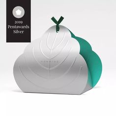 a white and green apple shaped object with the words peninsula silver on it's side