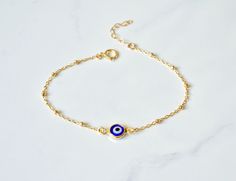 "Gold Filled Beaded Evil Eye Bracelet Handmade Turkish Glass and 18kt gold filled, every charm is made by hand so no one necklace is exactly the same. The charm on this necklace symbolizes good luck and safe keeping. Can be worn everyday and will not tarnish -Description Evil Eye Charm - Handmade Turkish Glass and 18kt gold filled, .5\" end to end Chain - 14kt Gold Filled Link or Beaded Chain Length- 5-8\" w/1\" extension See the last photo for bracelet measurement information The bracelets in t Gold Plated Beaded Bracelets As Gift, Gold Plated Chain Bracelet With Gold Beads For Gift, Gold Plated Round Beaded Bracelets For Gift, Gold-plated Round Beaded Bracelets As Gift, Round Gold-plated Beaded Bracelets As Gift, Gold Charm Bracelet With Adjustable Chain And Round Beads, Yellow Gold Beaded Chain Bracelet As Gift, Yellow Gold Chain Bracelet With Round Beads For Gifts, Gift Yellow Gold Charm Bracelet With Round Beads