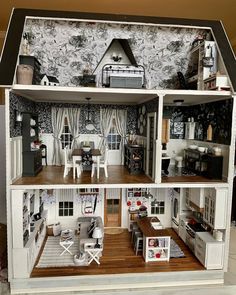 a doll house with furniture and accessories in it