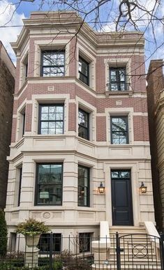 an apartment building with many windows and doors