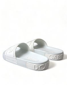 DOLCE & GABBANA Gorgeous brand new with tags, 100% Authentic Dolce & Gabbana white logo embossed slides are crafted with rubber in Italy and feature a wide strap and heel counter with tonal branding, a molded footbed and a lightweight sole. Model: Sandals slides flats Material: 100% Rubber Colour: White Logo details Made in Italy Italy Logo, Men Parka, Rubber Sandals, Boot Pumps, Denim Jacket Men, Dolce E Gabbana, Mens Shoes Boots, Shopper Tote, Ciabatta