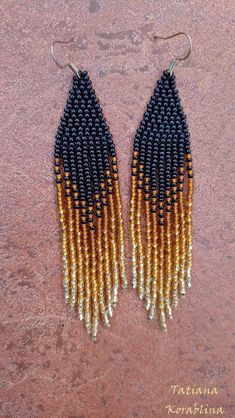 These handmade earrings are made of high-quality Czech beads and strong synthetic thread. They are elegant, fashionable, and highly versatile, suitable for everyday wear. Color: black,bronze,gold. There may be some color discrepancies which is due to the different monitor settings 100% hand made with love! Measurements: Length-about 11.5cm (4.33 inch) Width -about 2 cm (0.79 inch) Materials: Sterling silver components Czech glass beads Strong bead weaving thread Black Fringe Earrings With Round Beads, Elegant Handwoven Black Beaded Earrings, Elegant Black Handwoven Beaded Earrings, Black Handwoven Dangle Jewelry, Black Earrings With Handwoven Round Beads, Black Handwoven Earrings With Round Beads, Handwoven Black Beaded Dangle Earrings, Black Handwoven Dangle Earrings, Handwoven Black Beaded Earrings