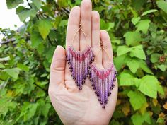 Hand beaded Delica seed bead earrings Bead earrings measuring approx. length 4.016'' (10.2cm), from top of ear wire to bottom fringe. Width 1.61'' (4.1cm)  These beaded fringe earrings feature gorgeous colors of lilac and purple. In the bottom of these beaded earrings, there are glass crystals which give these earrings a lovely shimmer.  Handwoven with needle and thread, these earrings have 19 strands flowing down of a gold color metal hoop.  Stand out of the crowd with those statement earrings! Bohemian Purple Earrings With Tiny Beads, Purple Dangle Beaded Earrings With Spacer Beads, Handmade Purple Beaded Earrings, Purple Handwoven Earrings As A Gift, Bohemian Jewelry Gift, Earrings Bead, Gift For Daughter, Beaded Fringe, Lilac Purple