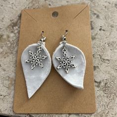 White Jewelry For Winter Holiday, White Drop Earrings For Holiday, White Drop Earrings For Holidays, Nickel-free White Earrings For Christmas, White Dangle Earrings For Holiday, White Holiday Earrings With Ear Wire, White Snowflake Earrings For Christmas, White Snowflake Earrings For Gift, White Snowflake Earrings For Winter