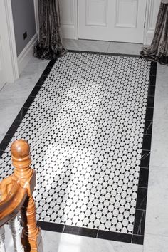 a black and white tiled floor in a house