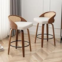 two white stools sitting in front of a mirror on top of a wooden floor