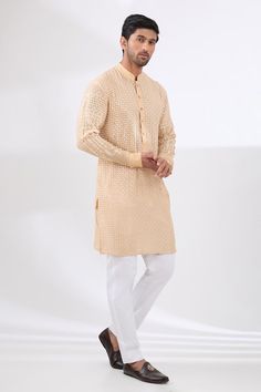 Beige kurta with sequin and thread tonal embroidery in geometric pattern. Paired with a white pant. - Aza Fashions Traditional Churidar With Chikankari Embroidery For Reception, Traditional Wear With Chikankari Embroidery For Reception, Traditional Wear Chikankari Embroidery For Reception, Traditional Chikankari Embroidered Churidar For Reception, Traditional Wear For Reception With Chikankari Embroidery, Eid Reception Traditional Wear With Chikankari Embroidery, Traditional Kurta With Chikankari Embroidery For Reception, Reception Straight Kurta With Chikankari Embroidery, Festive Chikankari Embroidery Kurta For Reception