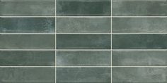 a gray tile wall that has been painted in shades of green and grey with white lines