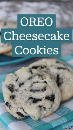 two blue plates filled with cookies sitting on top of a checkered table cloth next to each other