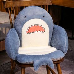 a chair with a stuffed shark on it