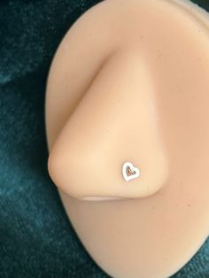 there is a small white heart on the back of a dummy