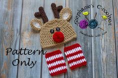 a crocheted reindeer hat, mittens and booties on a wooden surface