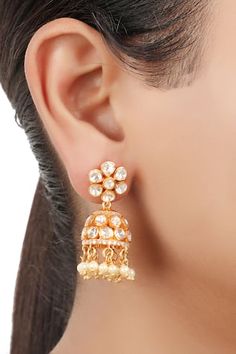 925 silver, gold finish jhumkas handcrafted in floral geometric cut work details, yellow moissanite polki, stones embellishment and synthetic pearl drop tassels.
Type: Moissanite Polki, Synthetic Pearls and Stones Embellished
Composition: 925 Silver
Color: Yellow
Other Details: 
Handcrafted
Floral geometric pattern
Dimensions (in inch): 1.85 x 0.59
Weight (in gms): 18
Closure: Push back - Aza Fashions Floral Geometric Pattern, Floral Geometric, Jewellery Earrings, Cut Work, Pearl Drop, Aza Fashion, Stone Jewelry, Gold Finish, Online Jewelry