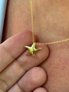 Our dainty starfish necklace is perfect for this summer! Information: ⭐️ Sterling Silver (925 stamped) | 14K Gold Plated ⭐️ Adjustable length: 16" - 18" ⭐️ Starfish charm size: about that of a dime ⭐️ Hypoallergenic ⭐️ Tarnish resistant This summer, starfishes and ocean inspired jewelry are your go-to jewelry staples. Our starfish necklace is dainty and looks amazing when layered. If you are going for a minimalist look, you can wear it by itself. Throughout centuries, starfishes have been seen a Yellow Gold Star Necklaces With Starfish Charm, Yellow Gold Starfish Necklace As Gift, Dainty Gold Starfish Necklace, Yellow Gold Starfish Charm Necklace For Beach, Yellow Gold Necklace With Starfish Charm For Beach, Dainty Starfish Necklace For Gift, Dainty Starfish Necklace As Gift, Ocean Inspired Jewelry, Ocean Necklace