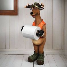 a deer is holding a roll of toilet paper