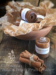 cinnamon and vanilla sugar in a bowl on a wooden table with some cinnamons next to it