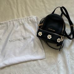 The Perfect Little On The Go Bag! This Michael Kors Mini Backpack Has Never Been Used And Comes With The Original Dust Bag! The Bag Is Navy Blue With White Flowers, And Features Removable And Adjustable Straps, And Two Zipper Compartments! Item Will Ship Within 2-4 Business Days. Michael Kors Backpack With Detachable Strap For Everyday Use, Michael Kors Backpack With Detachable Strap For Daily Use, Michael Kors Backpack For School, Michael Kors Mini Backpack, On The Go Bag, Go Bag, Michael Kors Mercer, Moda Outfit, Go Bags