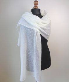 White mohair shawl Wedding wrap Woman mohair scarf Knit mohair silk shawl scarf Bridal mohair wrap scarf Handmade knitted warm, superfine shawl. This warm shawl is knitted from mohair and silk blend yarn. You can wear it every day and everywhere and pair it with any sort of look. Suitable for all seasons, for all life situations, celebration and special events. ❀ Material: Mohair 75%, Silk 25% ❀ Color: White ❀ Dimensions: Width: approx〜 55cm 〜22 inches Length: approx 〜190 cm 〜 75 inches ❀ Care i Elegant Alpaca Shawl Scarf, Elegant Alpaca Shawl, Elegant Alpaca Shawl Scarves, Elegant Hand Knitted Alpaca Shawl, Elegant Alpaca Scarves For Winter, White Winter Shawl As Gift, Hand Knitted Alpaca Shawl, White Winter Shawl Perfect As A Gift, White Winter Shawl Gift