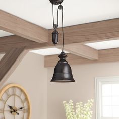 an old fashioned light fixture hangs from the ceiling