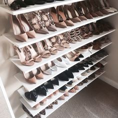 a white shoe rack filled with lots of shoes