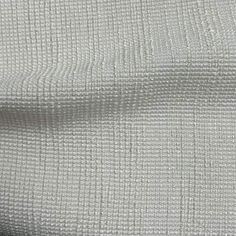 white fabric textured with small squares on the outside, as if it were woven into something