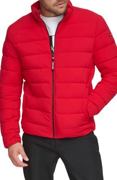 A tall stand collar structures this weather-ready puffer jacket crafted from stretch quilted fabric. Stand collar Long sleeves 100% Sorona polyester
 Machine wash, tumble dry Imported Model stats: 6'1" height, 32" waist. Model is wearing size Medium. Red Fitted Nylon Outerwear, Casual Red Down Puffer Jacket, Red Nylon Puffer Jacket For Fall, Red Nylon Puffer Jacket For Cold Weather, Fall Red Nylon Puffer Jacket, Calvin Klein Long Sleeve Puffer Jacket For Fall, Calvin Klein Long Sleeve Winter Puffer Jacket, Calvin Klein Fall Puffer Outerwear, Quilted Fabric