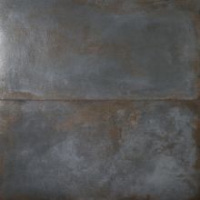 an old metal plate that has been scratched and rusted with some paint on it