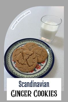 a close up of a plate of cookies on a table with a glass of milk