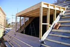 an unfinished roof is being installed on a house