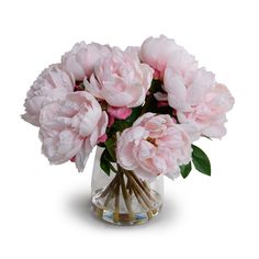 a vase filled with pink flowers on top of a table