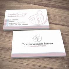 two business cards sitting on top of a wooden table