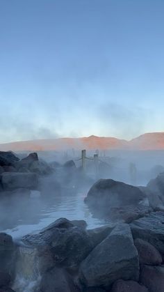 the water is full of steam and rocks